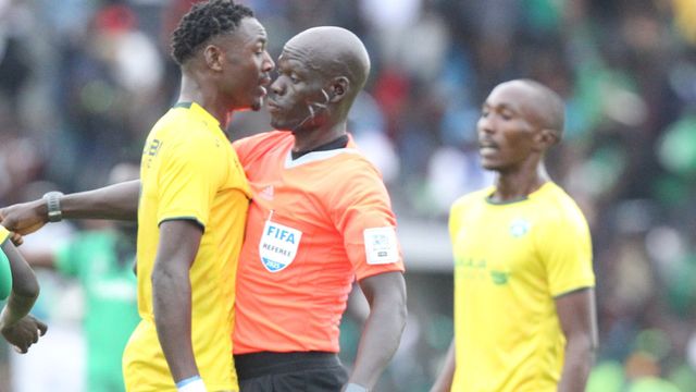 John Otieno and referee Brooke Philips